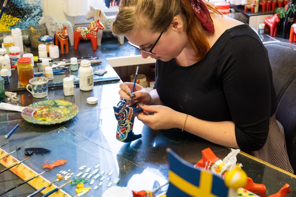 Making of traditional dalahäst dalahorse at Nils Olsson Dalahäster Dalarna Sweden