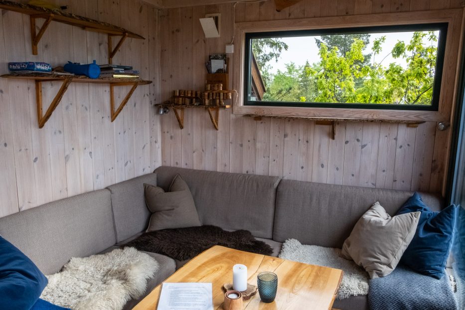 Tretopphytter Oslofjord, Norway, treetop cabin, couch, livingroom, Falkeredet