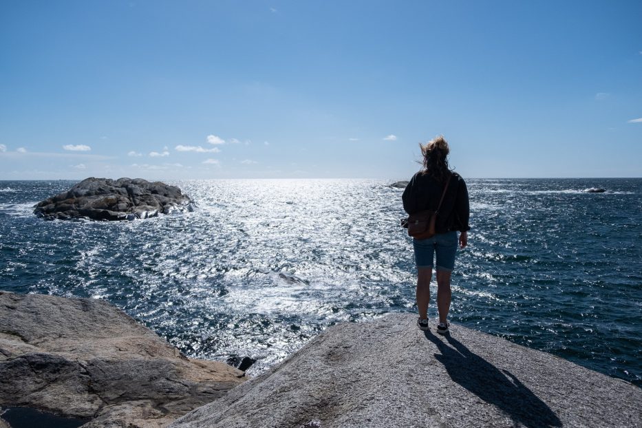 Girl looking out at the view from Verdens Ende, Tjøme, Norway