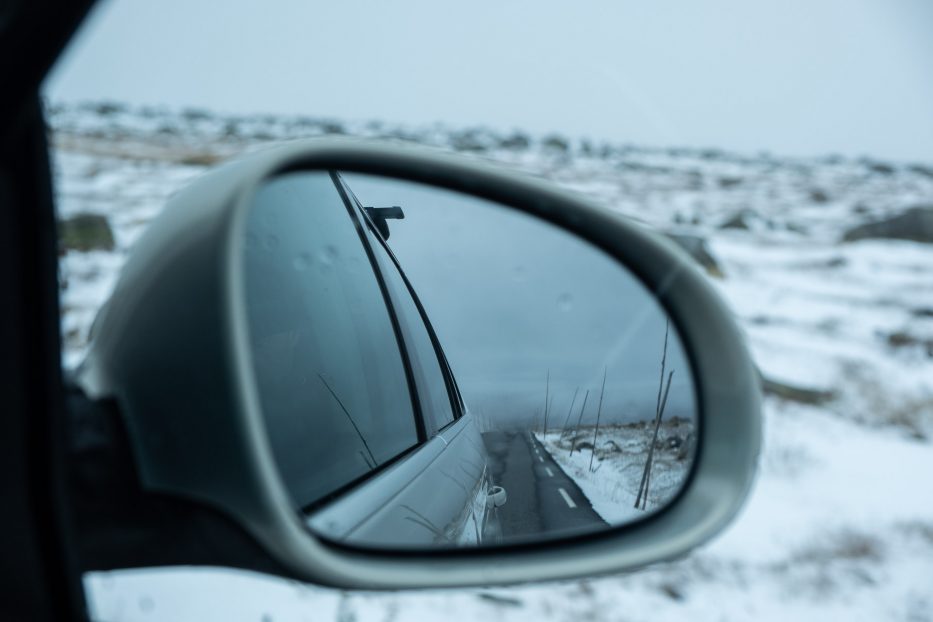 view over Valdresflya covered in snow through a car window