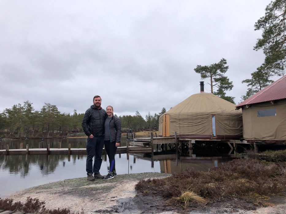 man and woman standing together in front of a yurt at canvas telemark in Norway