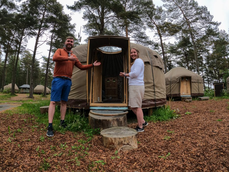 Man and woman standing in front of a luxury yurt at Canvas Hove