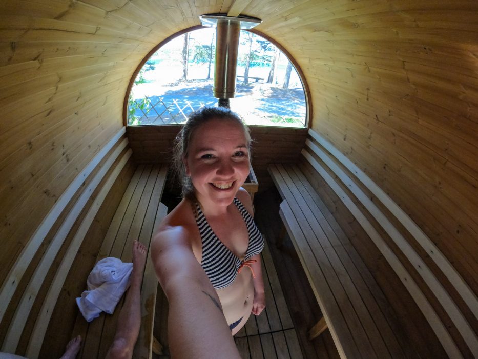 woman smiling while taking a selfie in the sauna at canvas hove