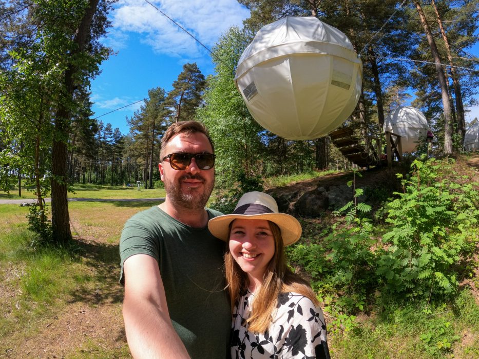 man and woman taking a selfie in front of the cocoon at canvas hove