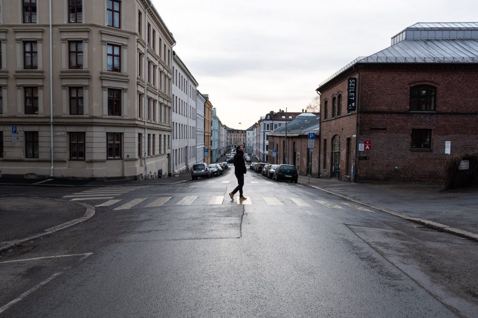 man crossing the street in Oslo