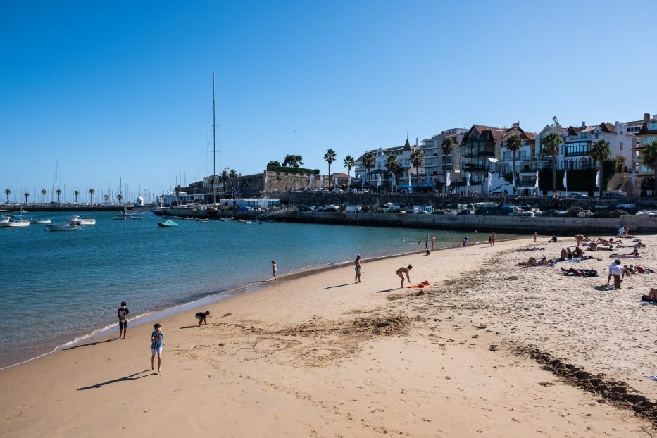 kids playing at the beach in the city centre of cascais