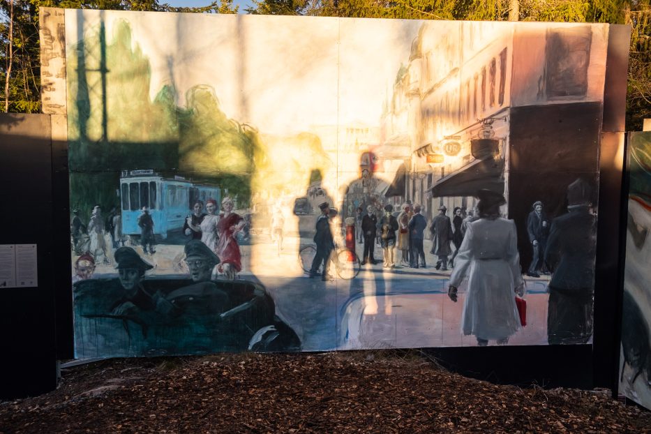 artwork at the rose castle with the sun shining on it and the shadows of two people watching it