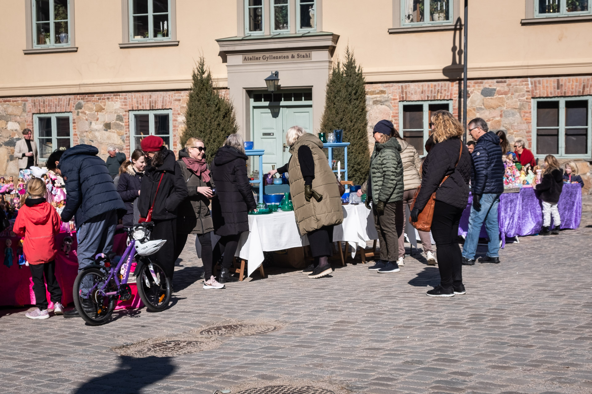 people looking at stuff at the market in the old part of fredrikstad