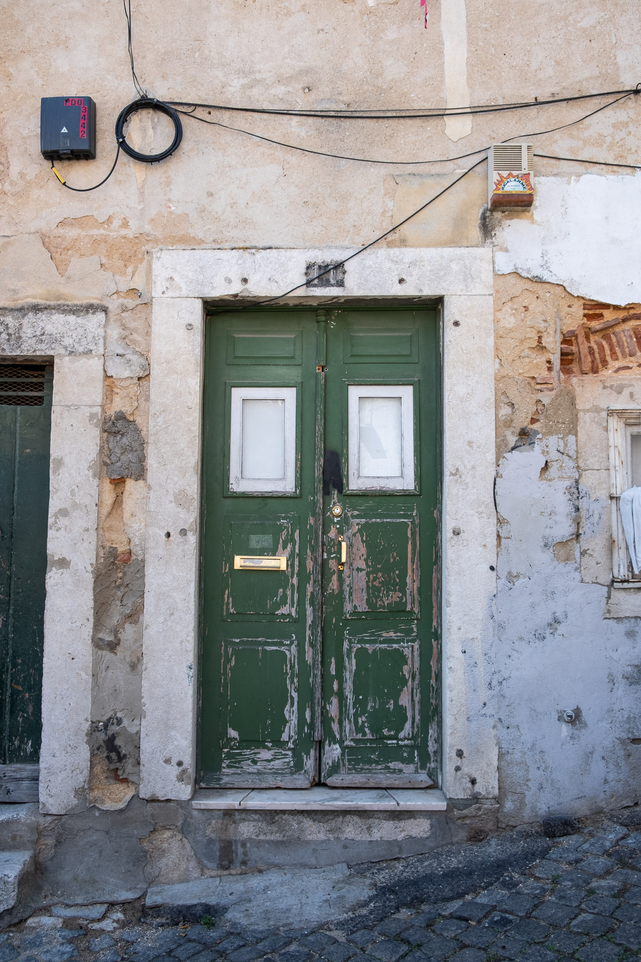 green door with flaking paint