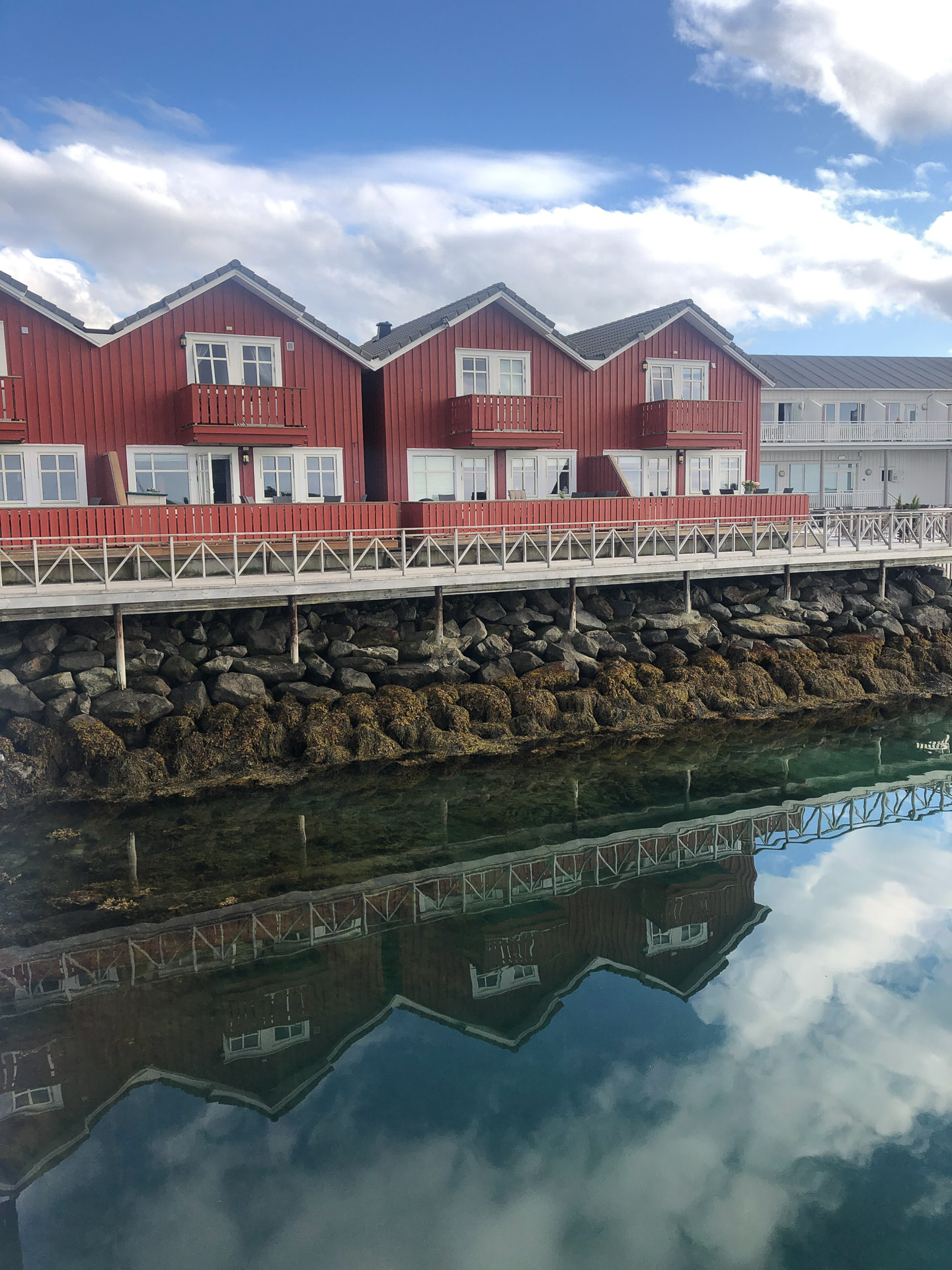wooden houses and reflection in the water at kjerringøy
