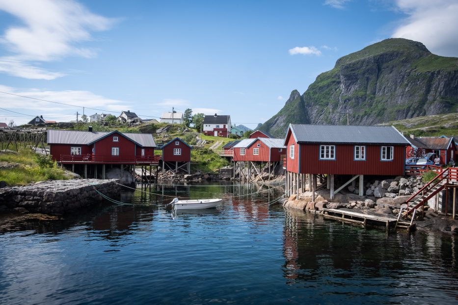 classical Lofoten view with red wooden houses the sea and mountains