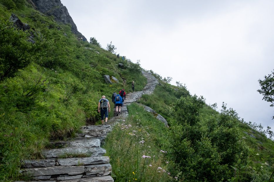 people climbing the steep sherpa steps at reinebringen