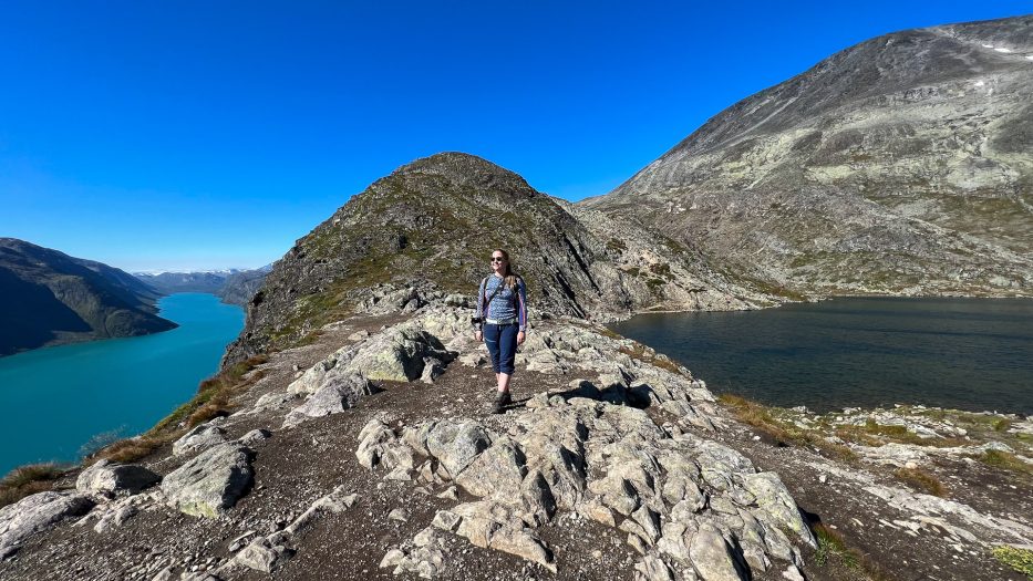 woman posing at besseggen while hiking in norway