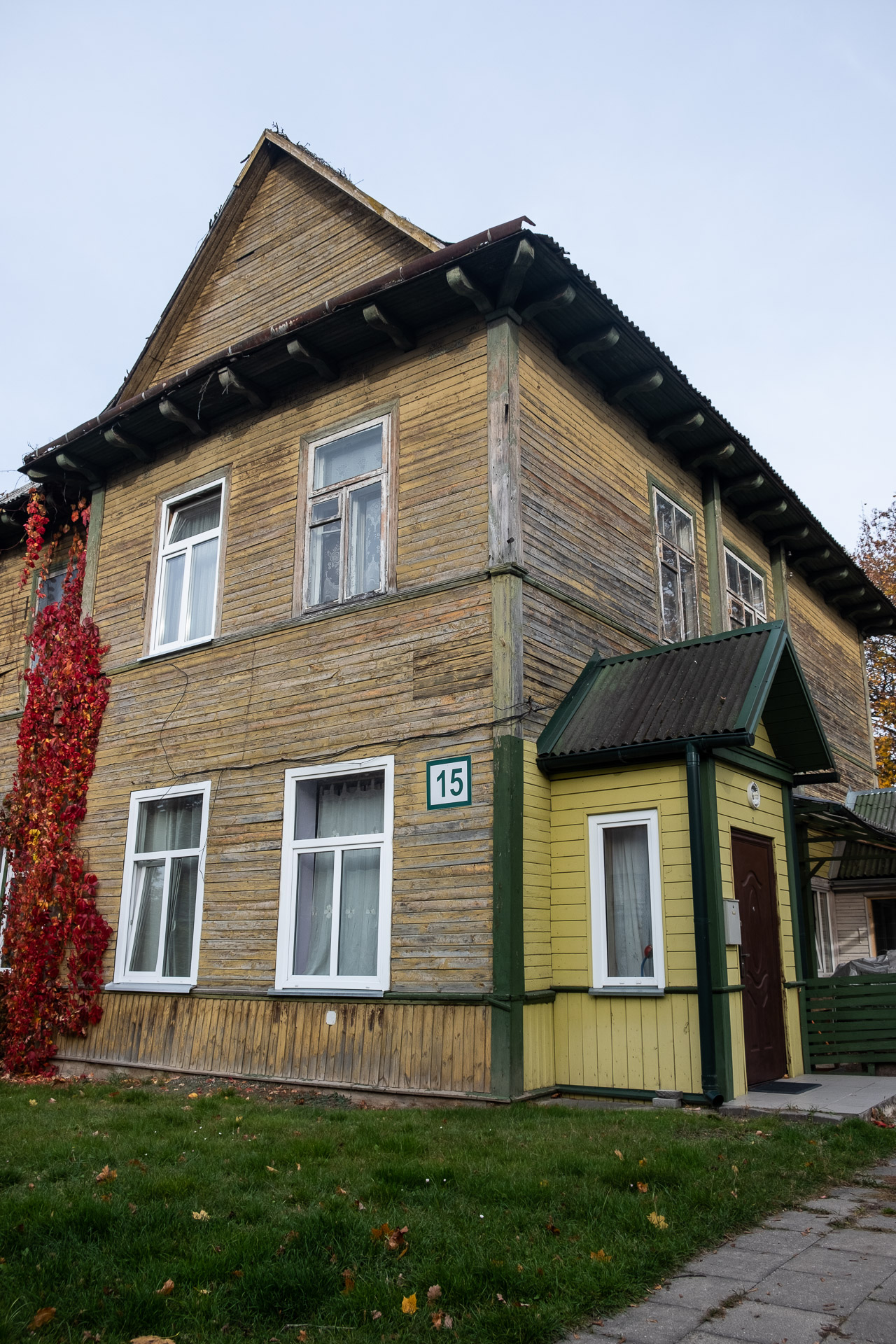 old brown house with green details