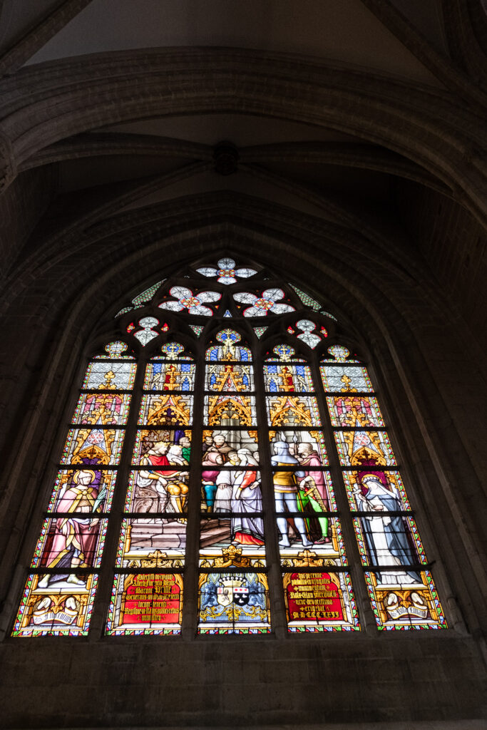 glass stained paintings inside of a church in brussels