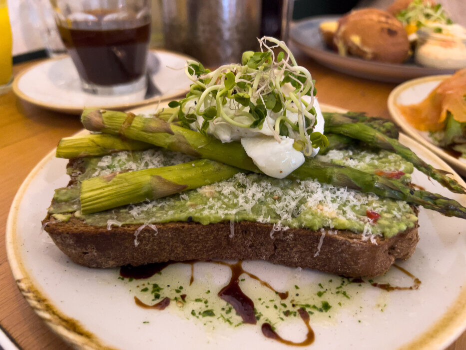 a sandwich with avocado and asparagus