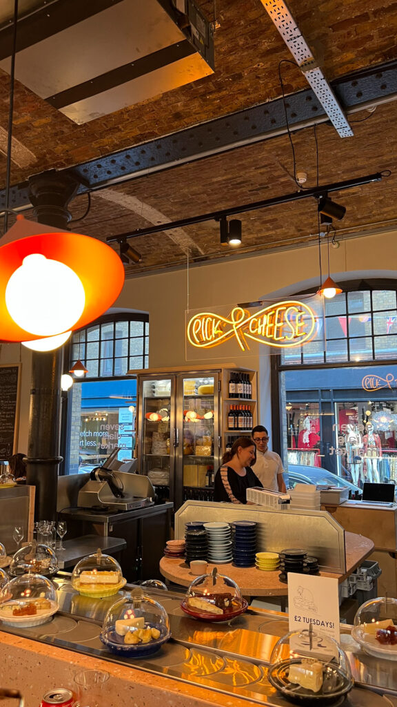 cheese conveyer belt at pick & cheese at seven dials market in london