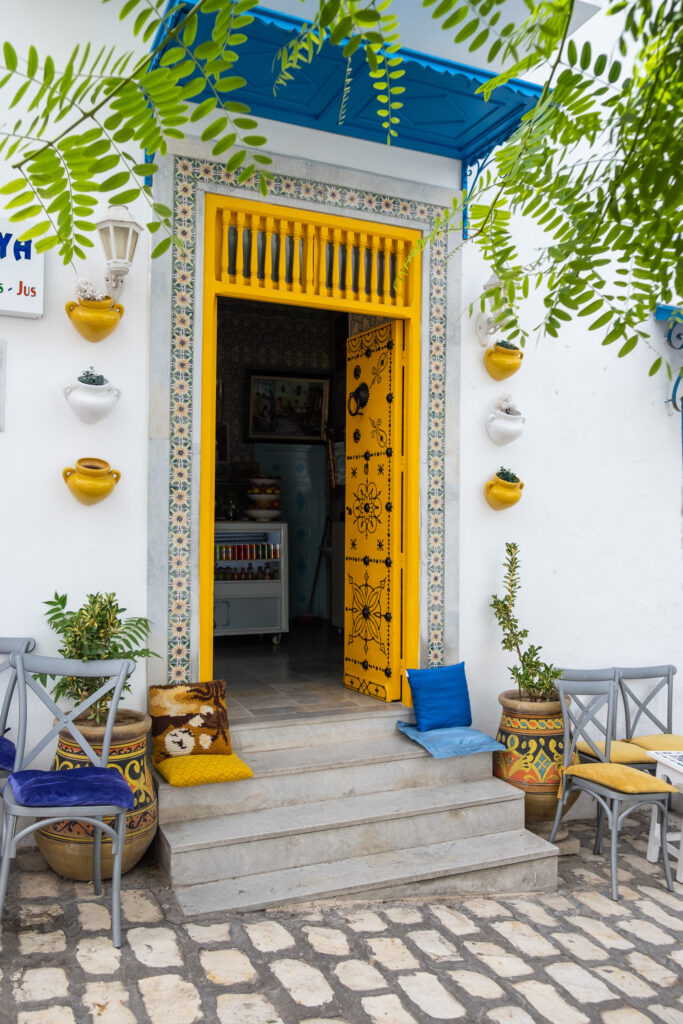 happy colourful details outside a cafe in sidi bou said