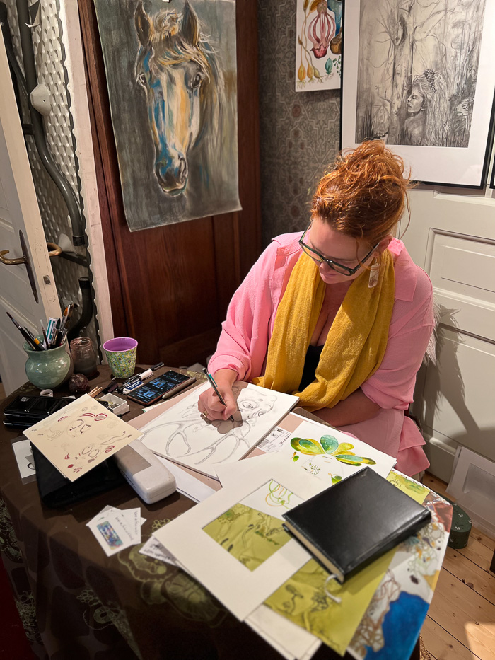 woman drawing inside a shop in wadköping area