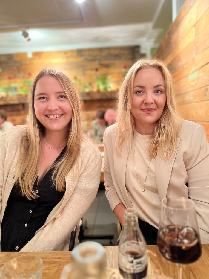 two smiling ladies at restaurant gro