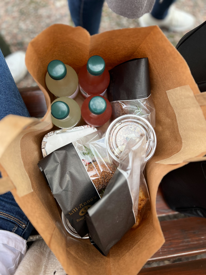 a paper bag filled with bottles and food from lill-annas seen from above