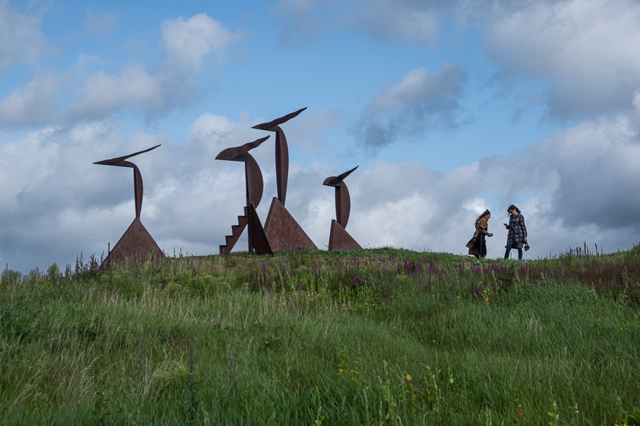 two women standing next to an art installation at konst på hög