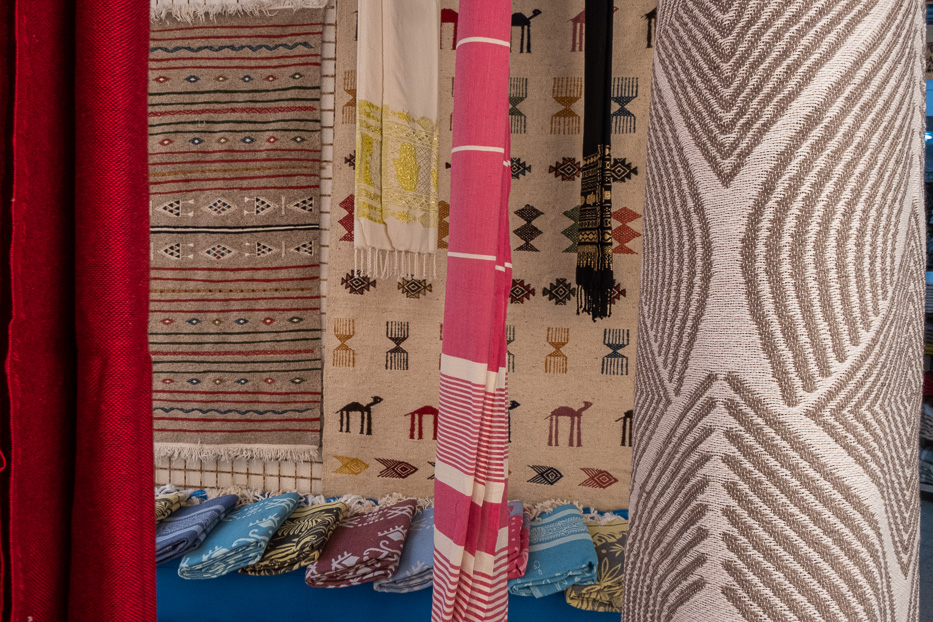 colourful carpets and scarves in the medina in tunisia