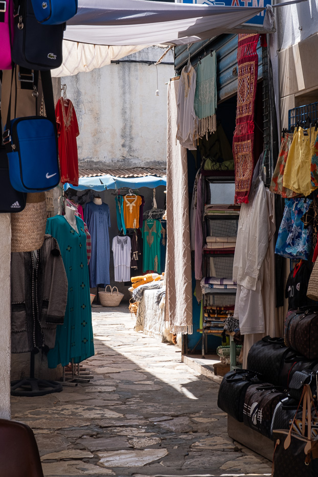 colourful dresses on display in the medina of hammamet